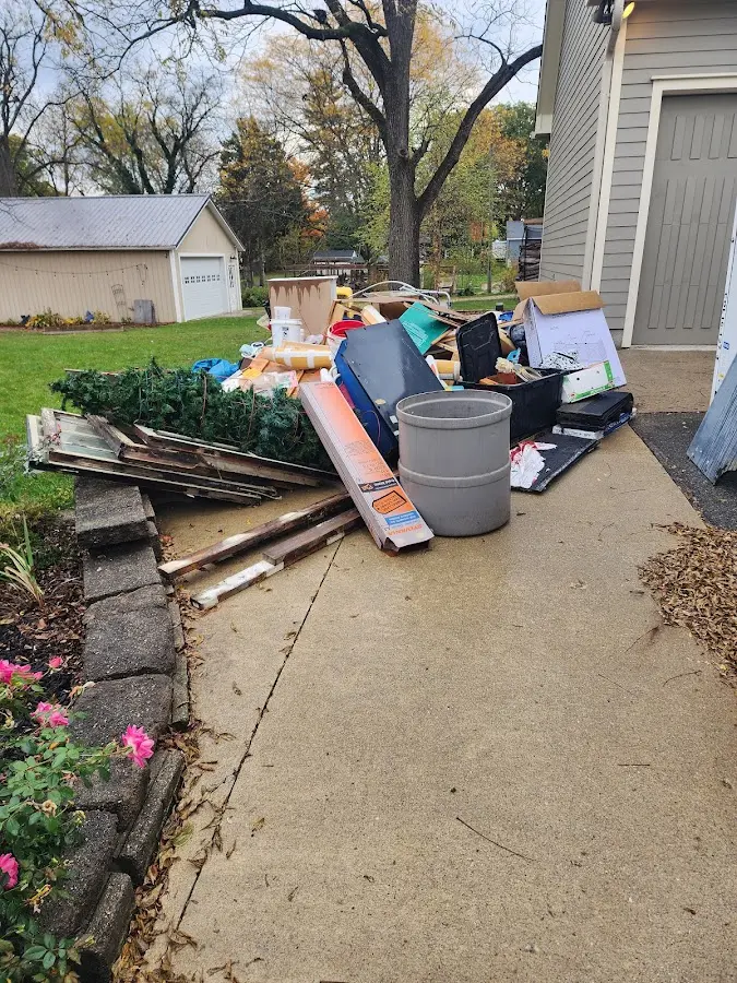 Dumpster being loaded with debris for Commercial Dumpster Rental in Lovington